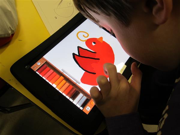 Student drawing on iPad